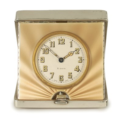 Lot 1173 - AN ART DECO SILVER AND GUILLOCHE ENAMEL TRAVELLING BOUDOIR CLOCK