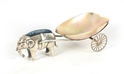 Lot 364 - A RARE EDWARD VII SILVER PIN CUSHION IN THE FORM OF AN ELEPHANT PULLING A MOTHER OF PEARL CART
