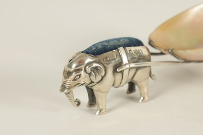 Lot 568 - A RARE EDWARD VII SILVER PIN CUSHION IN THE FORM OF AN ELEPHANT PULLING A MOTHER OF PEARL CART