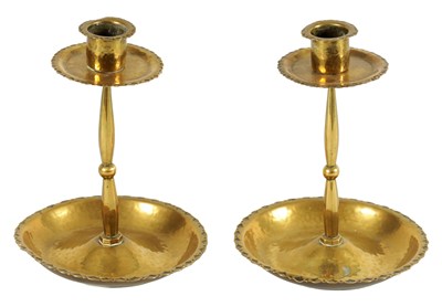 Lot 541 - A PAIR OF ARTS AND CRAFTS PLANISHED BRASS CANDLESTICKS