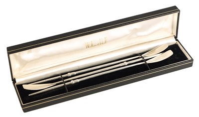 Lot 356 - A CASED SET OF THREE SILVER COCKTAIL STIRERS