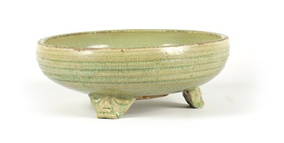 Lot 155 - AN EARLY CELADON MING DYNASTY TRIPOD BULB BOWL