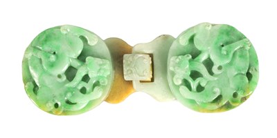 Lot 151 - A 19TH CENTURY CHINESE GREEN JADE CARVED BELT BUCKLE