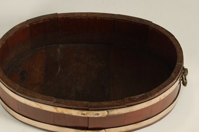 Lot 1189 - A GEORGIAN OVAL COOPERED BRASS BOUND WALNUT PLANTER/WINE COOLER