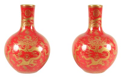 Lot 116 - A PAIR OF 19TH CENTURY CHINESE CORAL RED AND GILT DECORATED BOTTLE VASES