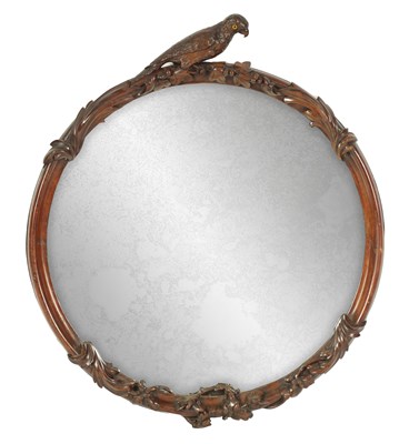 Lot 1109 - A 19TH CENTURY CARVED PADUK CIRCULAR HANGING MIRROR