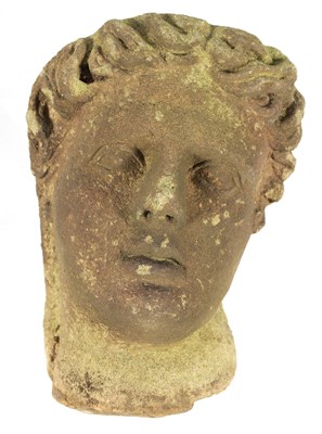 Lot 794 - AN EARLY ROMANESQUE STYLE CARVED STONE HEAD