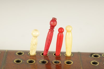 Lot 935 - A GOOD 18TH CENTURY WALNUT AND BRASS INSET CRIBBAGE BOARD