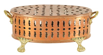 Lot 512 - AN UNUSUAL 19TH CENTURY BRASS AND COPPER TWO-HANDLED PIERCED OVAL FOOT WARMER