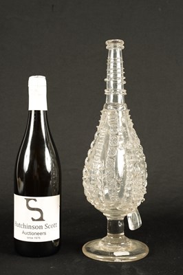 Lot 25 - AN 18TH CENTURY LARGE TAPERING CLEAR GLASS FLASK