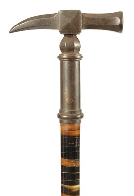 Lot 461 - A LATE 19TH CENTURY SEGMENTED HORN WALKING STICK WITH PATINATED METAL HAMMER HEAD HANDLE