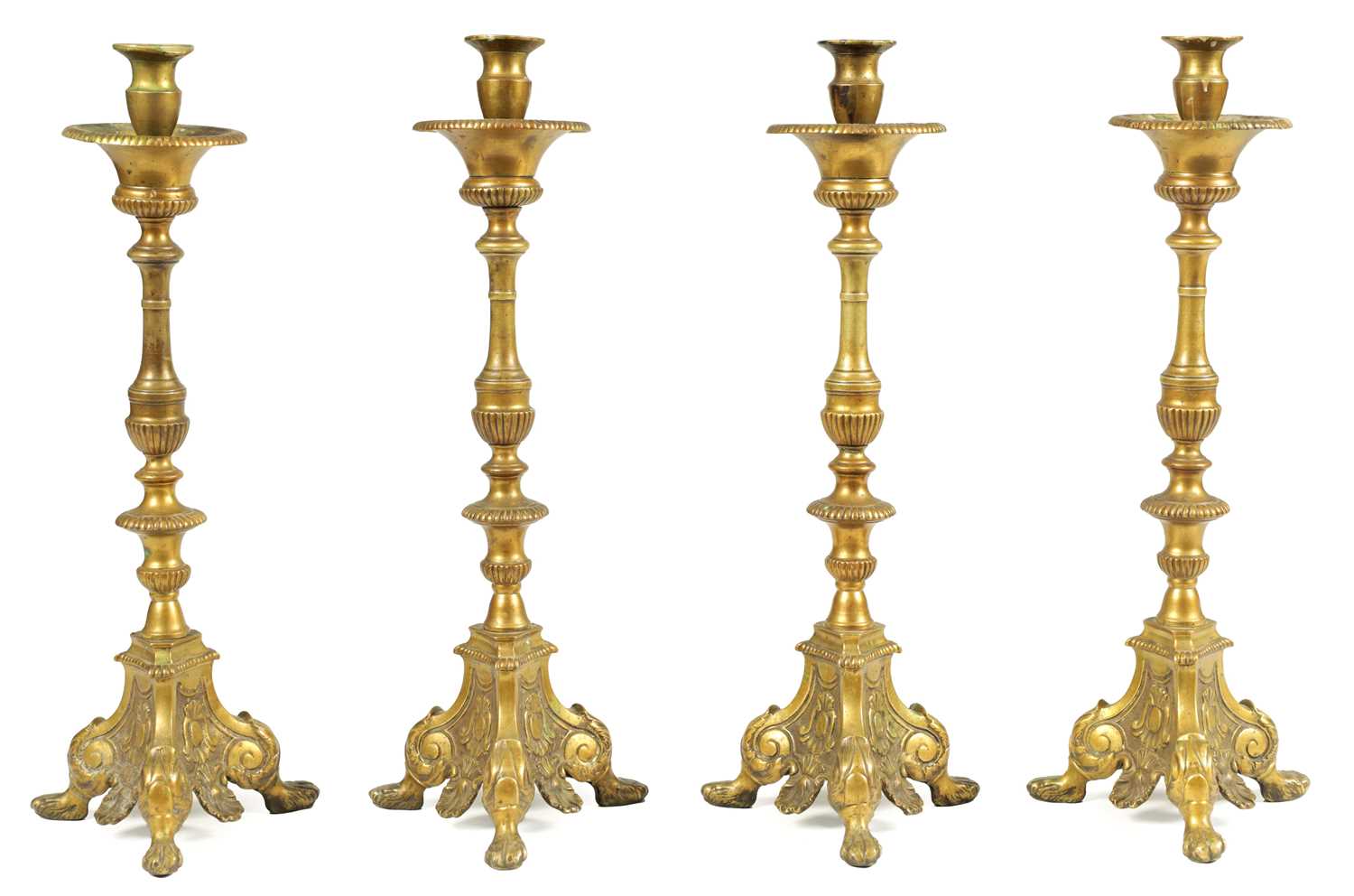 Lot 501 - A SET OF FOUR 18TH CENTURY CONTINENTAL LARGE BRASS CANDLESTICKS