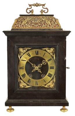 Lot 1009 - A 17TH CENTURY STYLE CONTINENTAL EBONY VENEERED AND GILT BRASS MOUNTED BASKET TOP BRACKET CLOCK