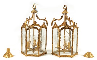 Lot 747 - A PAIR OF 19TH CENTURY  GILT BRASS HANGING HALL LANTERNS