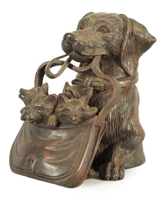 Lot 574 - A FINELY CARVED 19TH CENTURY BLACK FOREST DOGS HEAD INKWELL