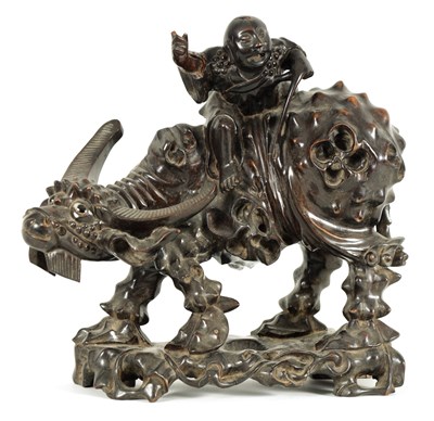 Lot 225 - A 19TH CENTURY CHINESE CARVED HARDWOOD SCULPTURE OF A WATER BUFFALO AND RIDER