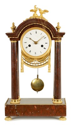 Lot 974 - AN EARLY 19TH CENTURY FRENCH ROUGE MARBLE AND ORMOLU PORTICO MANTEL CLOCK