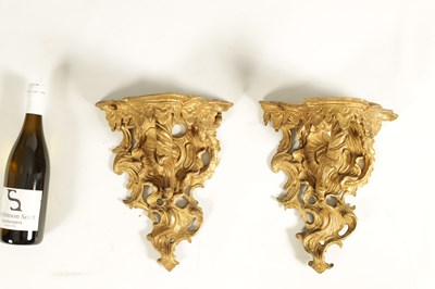 Lot 552 - A PAIR OF EARLY GEORGE III CARVED GILTWOOD WALL BRACKETS