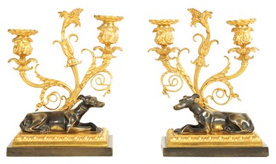 Lot 683 - A PAIR OF REGENCY BRONZE AND ORMOLU TWO BRANCH CANDELABRA