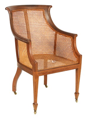 Lot 1105 - MAPLE & CO. A LATE 19TH CENTURY BOXWOOD STRUNG MAHOGANY BERGERE LIBRARY CHAIR