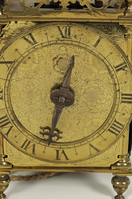 Lot 388 - A FIRST PERIOD ENGLISH BRASS LANTERN CLOCK