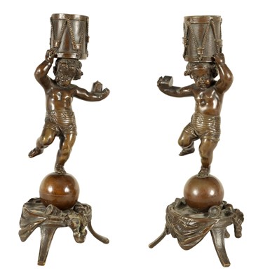 Lot 573 - A PAIR OF 19TH CENTURY FIGURAL BRONZE CANDLESTICKS