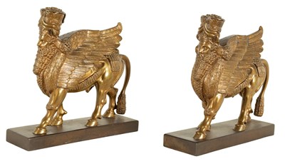 Lot 552 - A PAIR OF ENGLISH REGENCY GILT BRONZE ASSYRIAN SPHINXES