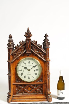 Lot 441 - W. ROSKELL, & CO. LIVERPOOL. A LATE 19TH CENTURY GOTHIC OAK TRIPLE FUSEE BRACKET CLOCK