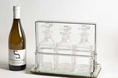 Lot 632 - A STYLISH 1930s SILVER PLATED TANTALUS WITH BACCARAT GLASS DECANTERS IN THE STYLE OF JACQUES ADNET