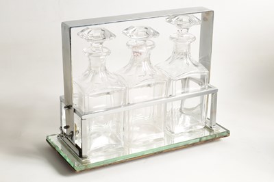 Lot 632 - A STYLISH 1930s SILVER PLATED TANTALUS WITH BACCARAT GLASS DECANTERS IN THE STYLE OF JACQUES ADNET