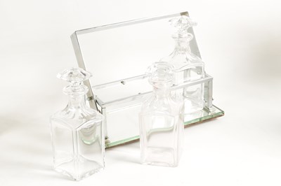 Lot 632 - A STYLISH 1930s SILVER PLATED TANTALUS WITH BACCARAT GLASS DECANTERS IN THE STYLE OF JACQUES ADNET
