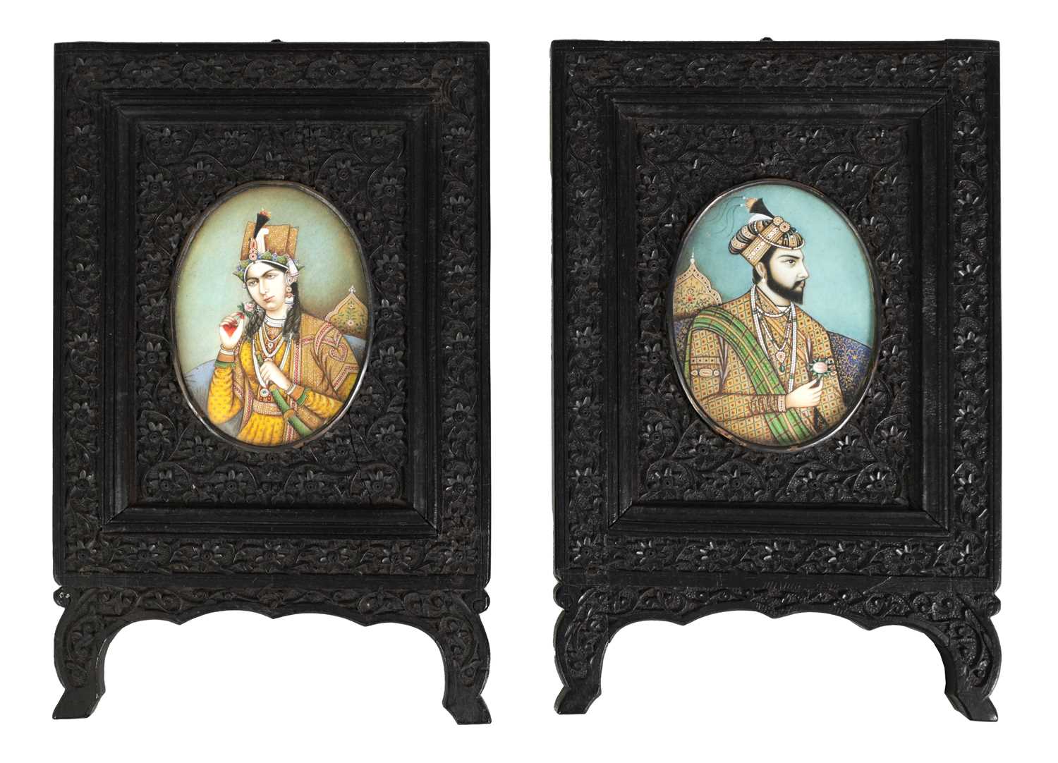 Lot 80 - A PAIR OF 19TH CENTURY INDIAN MINIATURES ON IVORY IN CARVED EBONY FRAMES