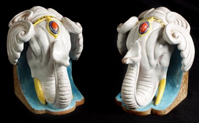 Lot 56 - A STYLISH PAIR OF 19TH CENTURY FRENCH MAJOLICA BOOKENDS FORMED AS ELEPHANTS HEADS