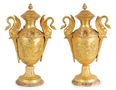 Lot 640 - A LARGE PAIR OF 19TH CENTURY FRENCH GILT METAL URNS ON MARBLE STANDS AFTER E. PICAULT