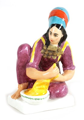 Lot 36 - A COLOURFUL RUSSIAN SEATED YOUNG LADY FIGURE OF A WASHER GIRL