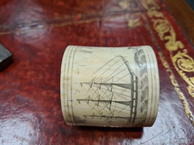 Lot 557 - A LATE 19TH CENTURY MARINE IVORY SCRIMSHAW LIDDED CONTAINER