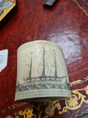 Lot 557 - A LATE 19TH CENTURY MARINE IVORY SCRIMSHAW LIDDED CONTAINER