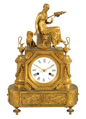 Lot 485 - A 19TH CENTURY FRENCH EMPIRE GILT ORMOLU MANTEL CLOCK