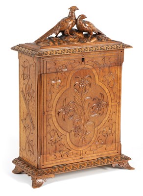 Lot 309 - A 19TH CENTURY BLACK FOREST CARVED WALNUT WRITING TABLE CABINET