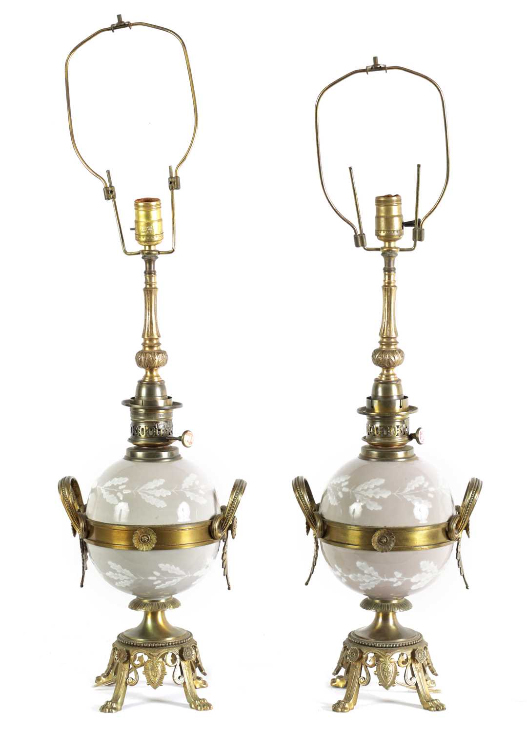 Lot 718 - A PAIR OF LATE 19TH CENTURY CAST GILT BRASS AND PORCELAIN OIL LAMPS CONVERTED FOR ELECTRICITY