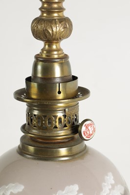 Lot 718 - A PAIR OF LATE 19TH CENTURY CAST GILT BRASS AND PORCELAIN OIL LAMPS CONVERTED FOR ELECTRICITY