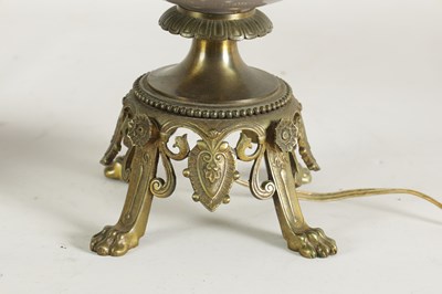 Lot 718 - A PAIR OF LATE 19TH CENTURY CAST GILT BRASS AND PORCELAIN OIL LAMPS CONVERTED FOR ELECTRICITY