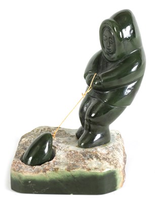 Lot 113 - AN ORIENTAL CARVED JADE SCULPTURE OF AN ESKIMO