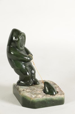 Lot 113 - AN ORIENTAL CARVED JADE SCULPTURE OF AN ESKIMO