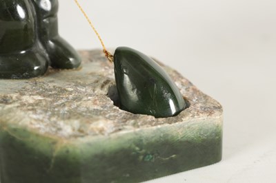 Lot 113 - AN ORIENTAL CARVED JADE SCULPTURE OF AN ESKIMO