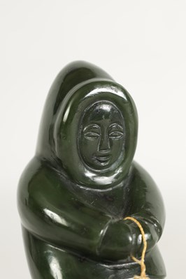 Lot 113 - AN ORIENTAL CARVED JADE SCULPTURE OF AN ESKIMO