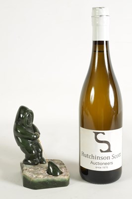 Lot 113 - AN ORIENTAL CARVED JADE SCULPTURE OF AN ESKIMO