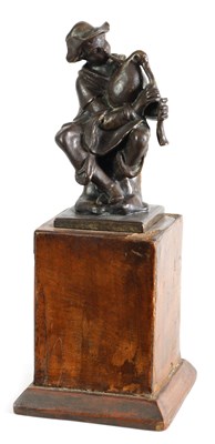 Lot 555 - A 19TH CENTURY BRONZE SCULPTURE OF A BAGPIPER