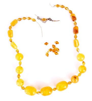 Lot 356 - A YELLOW AMBER BEAD NECKLACE on a string, of...