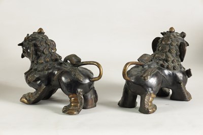 Lot 109 - A PAIR OF BRONZE CHINESE DRAGON LIONS